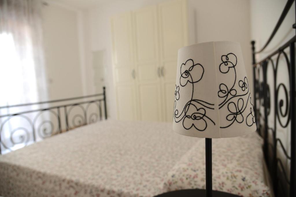 Postel nebo postele na pokoji v ubytování Jonico Guest House