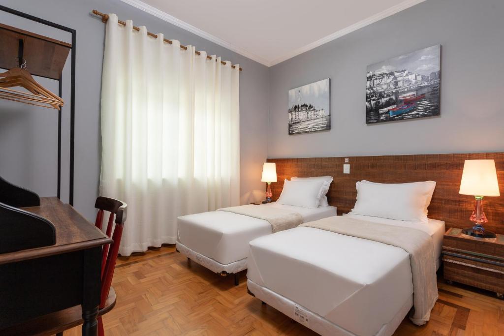 Postel nebo postele na pokoji v ubytování Hotel Pousada Pacaembu