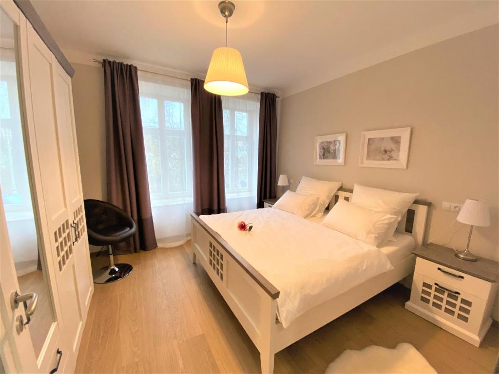 Łóżko lub łóżka w pokoju w obiekcie Apartments Magnolia