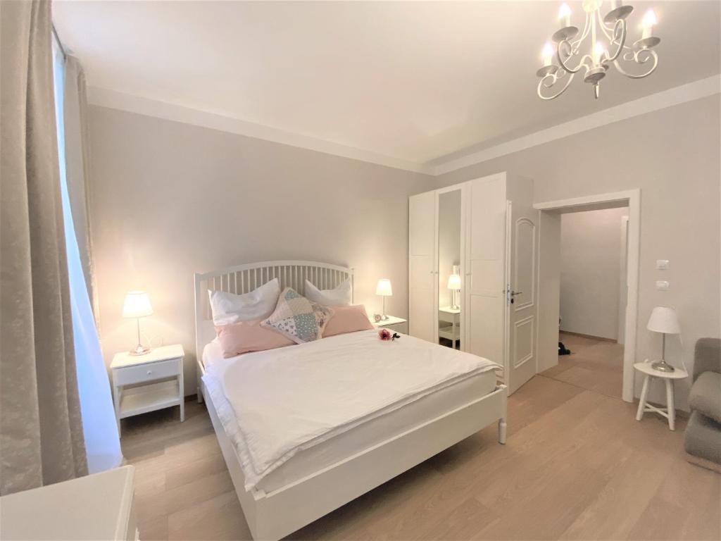 Łóżko lub łóżka w pokoju w obiekcie Apartments Magnolia