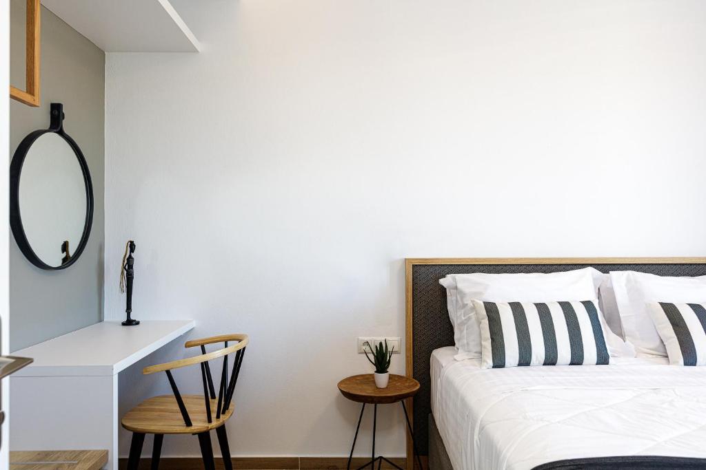 Łóżko lub łóżka w pokoju w obiekcie Eleven Boutique Suites