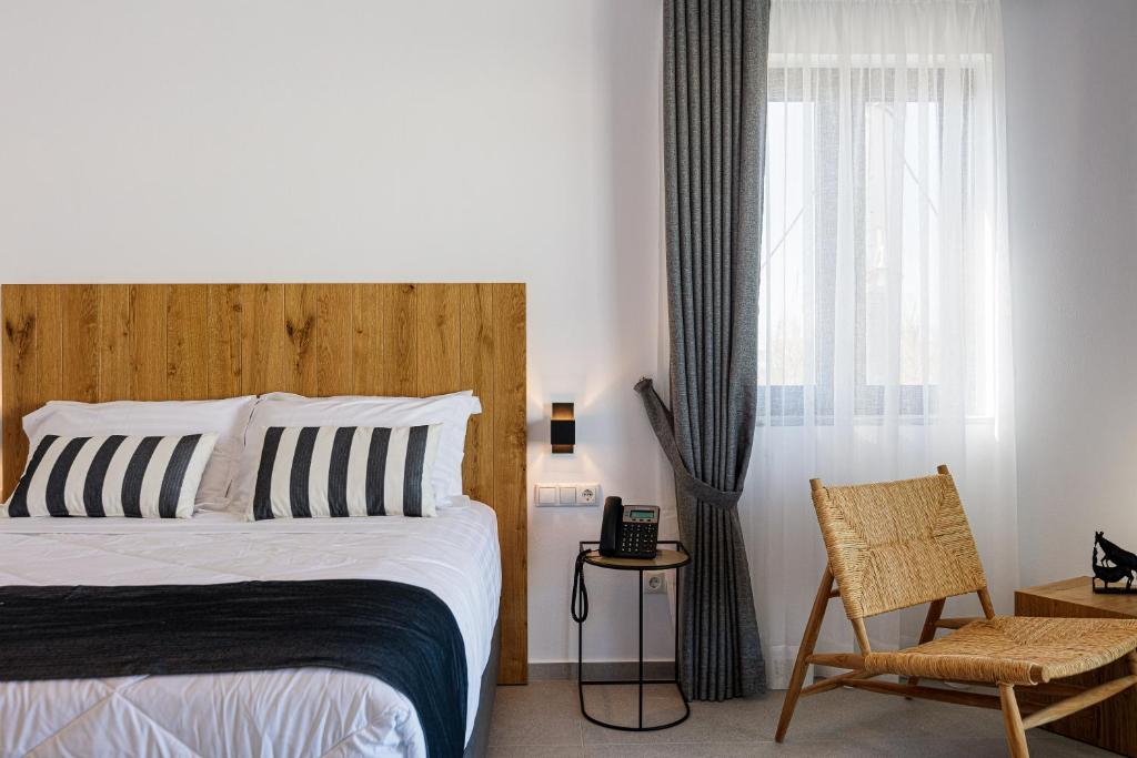 Łóżko lub łóżka w pokoju w obiekcie Eleven Boutique Suites