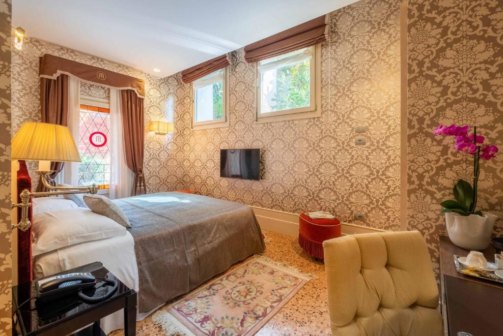 Postel nebo postele na pokoji v ubytování Hotel Moresco