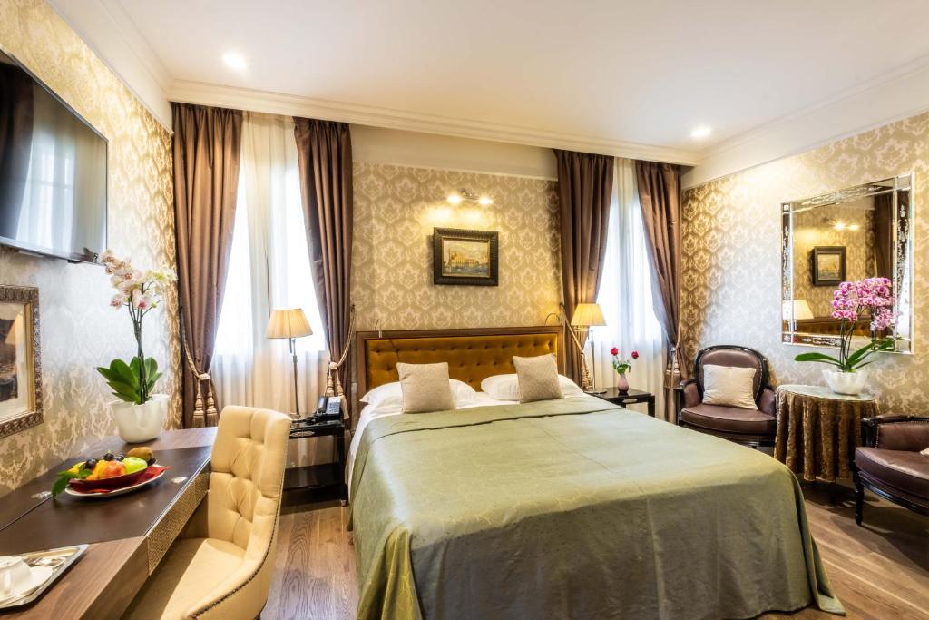 Postel nebo postele na pokoji v ubytování Hotel Moresco