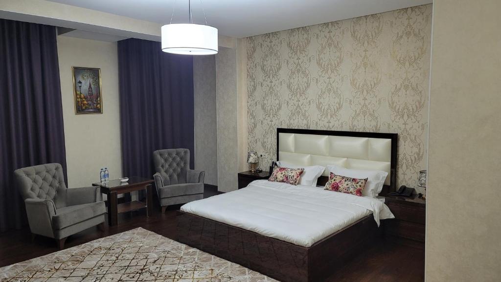 Postel nebo postele na pokoji v ubytování HOTEL AYNI