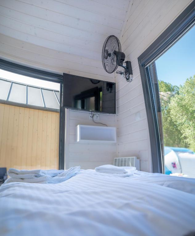 Voodi või voodid majutusasutuse Pod Cyprysami - surf & family resort toas