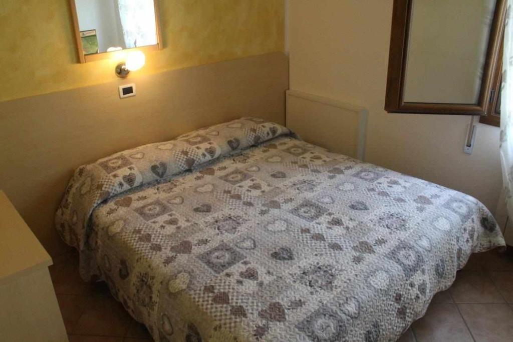 Łóżko lub łóżka w pokoju w obiekcie Agriturismo La Fraterna