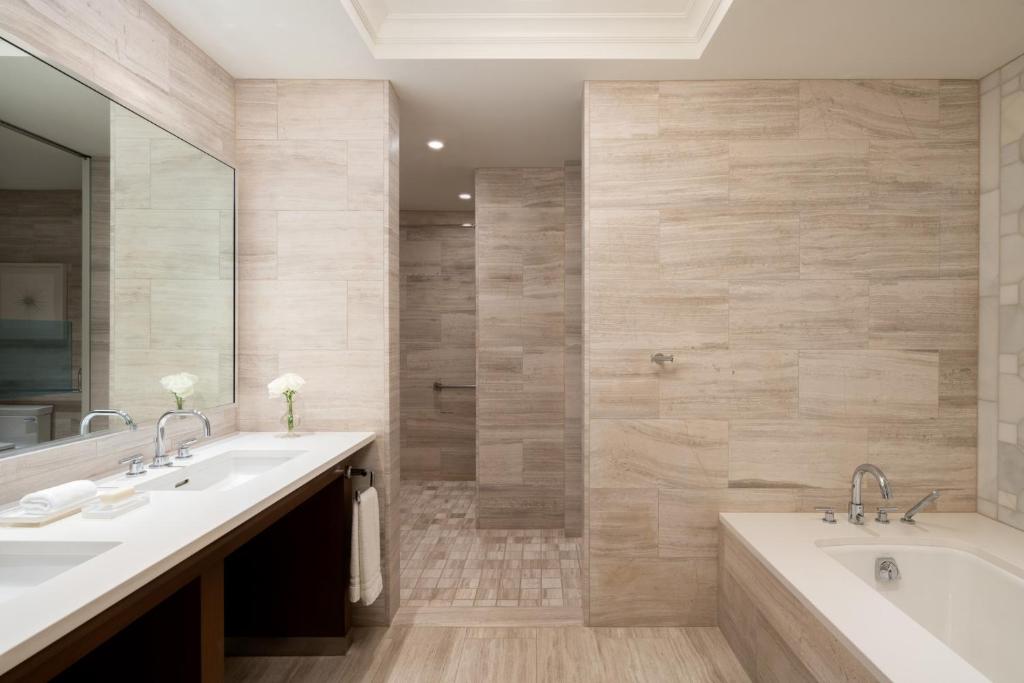 a bathroom with two sinks and a tub at Four Seasons Resort Orlando at Walt Disney World Resort in Orlando