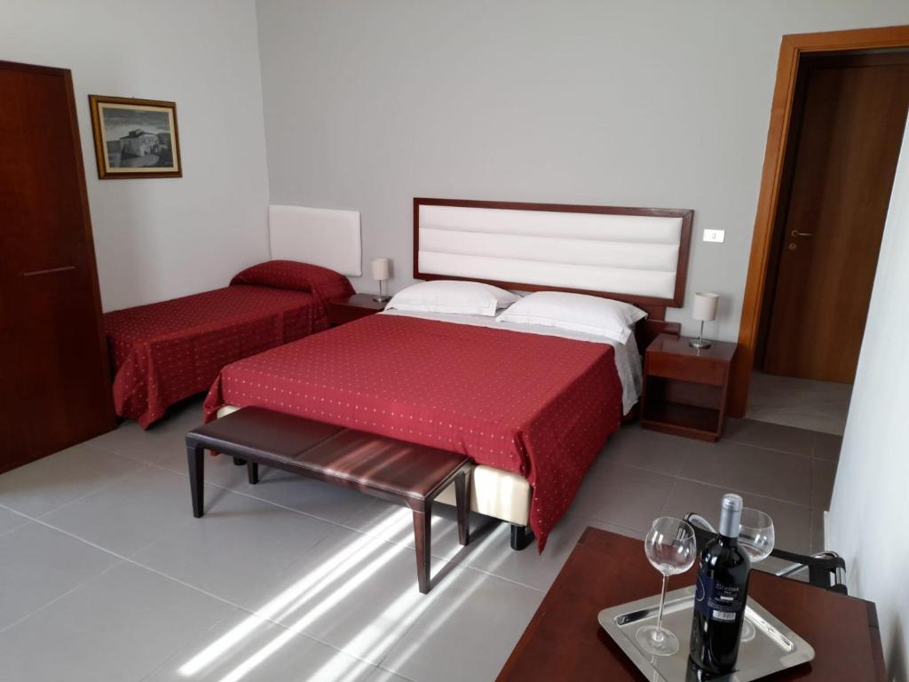 Posteľ alebo postele v izbe v ubytovaní Siracusa breakfast & rooms