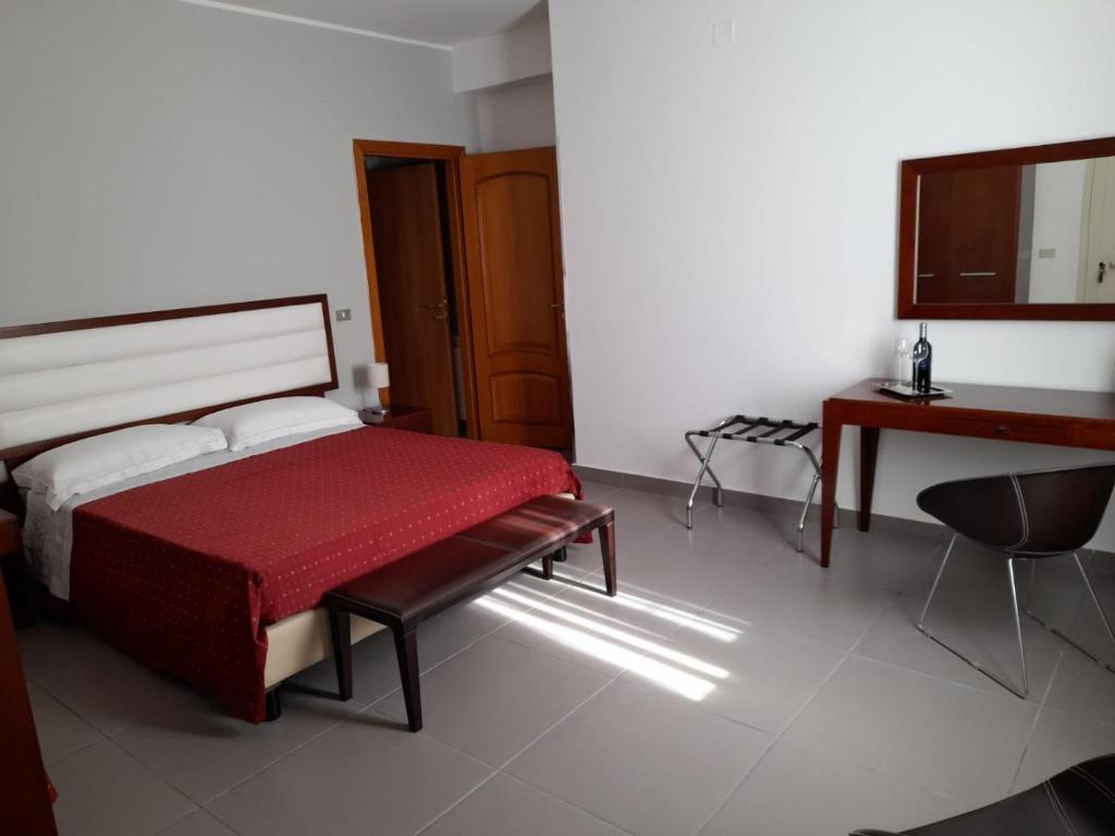 Posteľ alebo postele v izbe v ubytovaní Siracusa breakfast & rooms