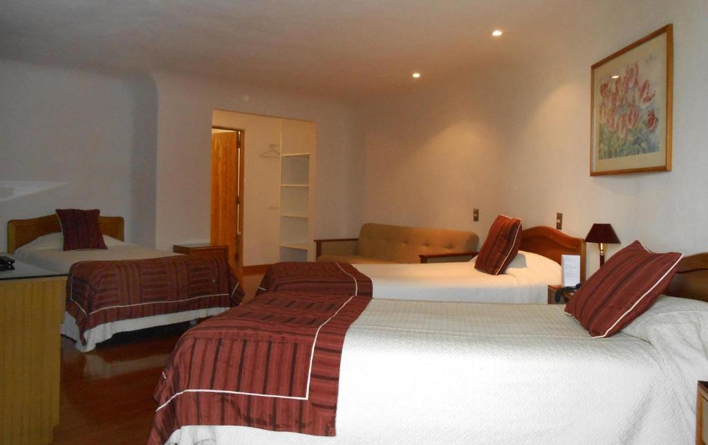 Postel nebo postele na pokoji v ubytování Hotel Montecarlo Viña del Mar