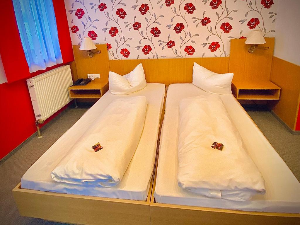 Postel nebo postele na pokoji v ubytování Meister BÄR HOTEL Am Wald