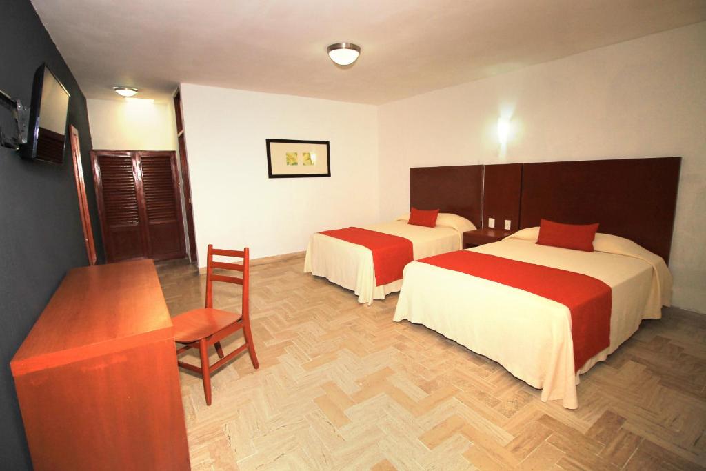 Postel nebo postele na pokoji v ubytování Hotel Central