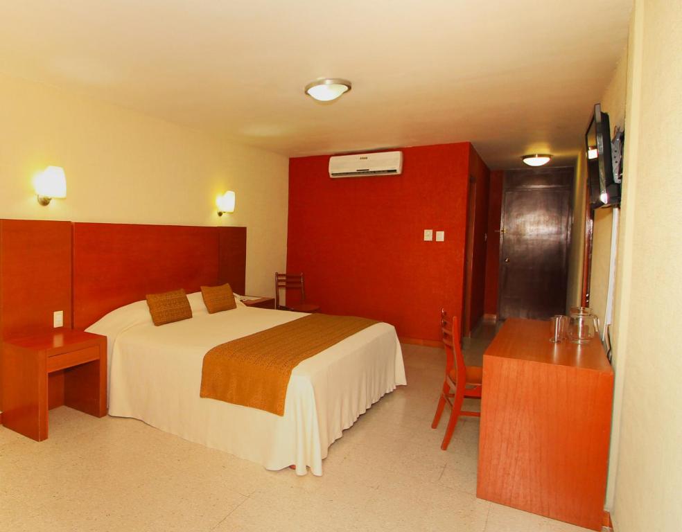 Postel nebo postele na pokoji v ubytování Hotel Central