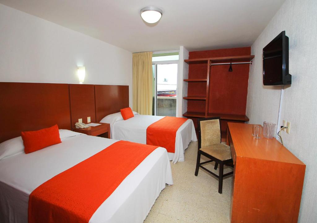 Postel nebo postele na pokoji v ubytování Hotel Central