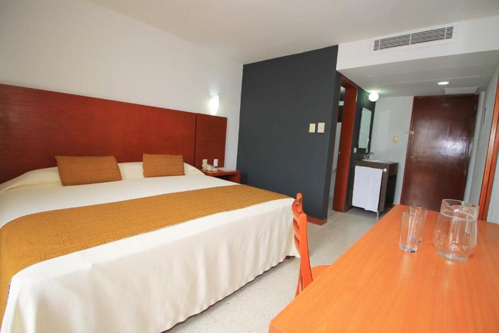 Postel nebo postele na pokoji v ubytování Hotel Central