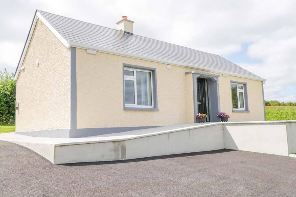 a house with a ramp in front of it at John & Margarets Place in Ballinamore