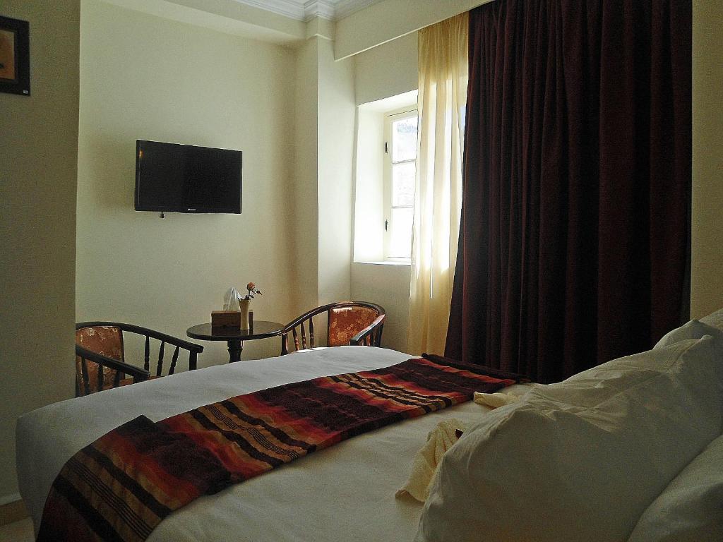 Postel nebo postele na pokoji v ubytování Hotel Riad Ben Atar