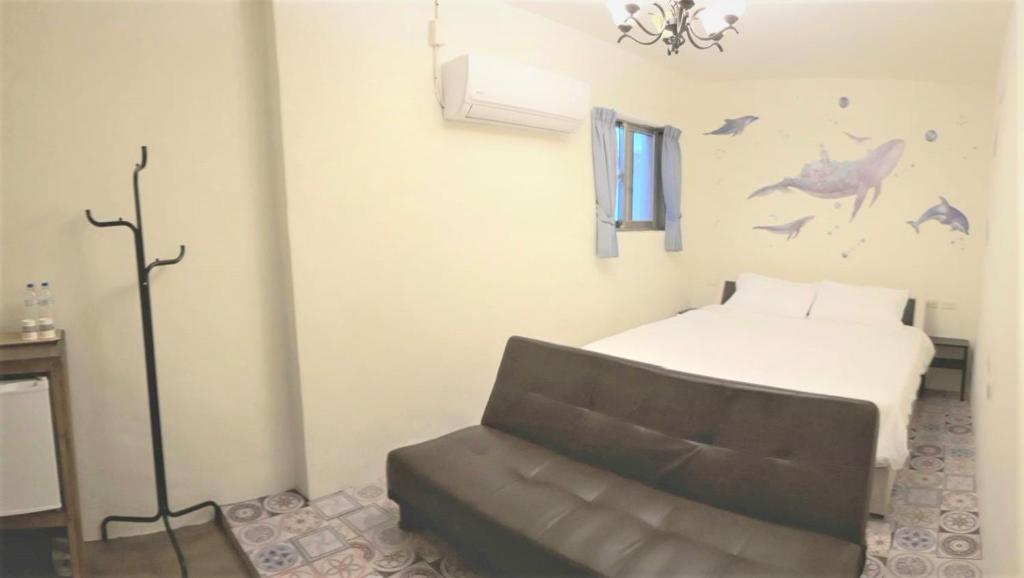 Postel nebo postele na pokoji v ubytování Kenting Good Homestay