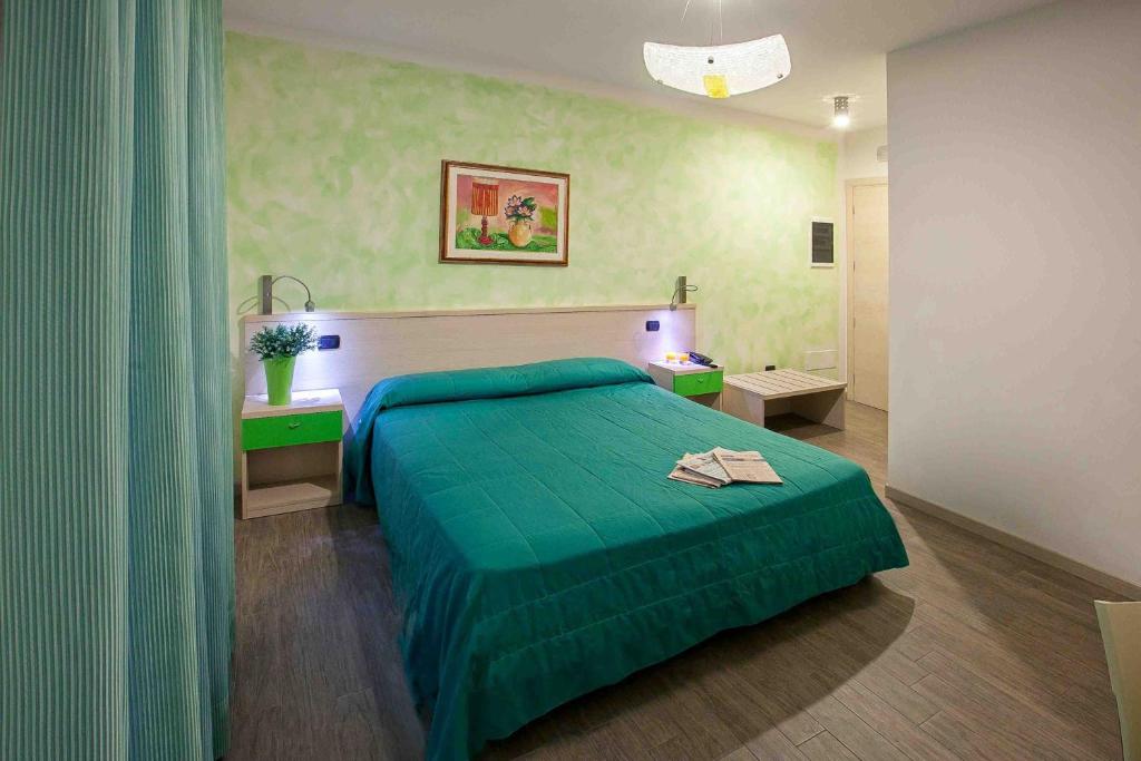 Postel nebo postele na pokoji v ubytování Albergo Antica Corte Marchesini