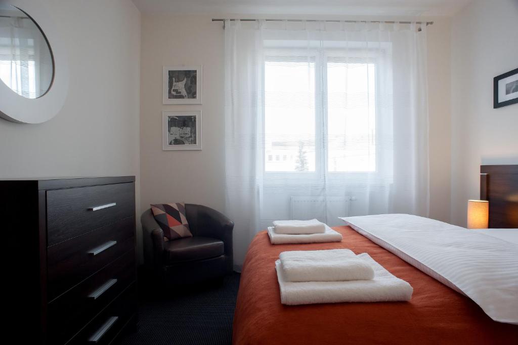 Postel nebo postele na pokoji v ubytování Apartamenty Starówka - Melody
