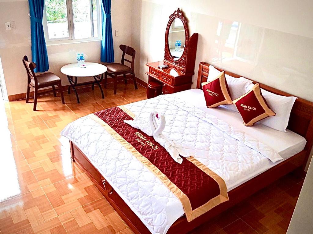 Giường trong phòng chung tại Minh Khoi Guest House