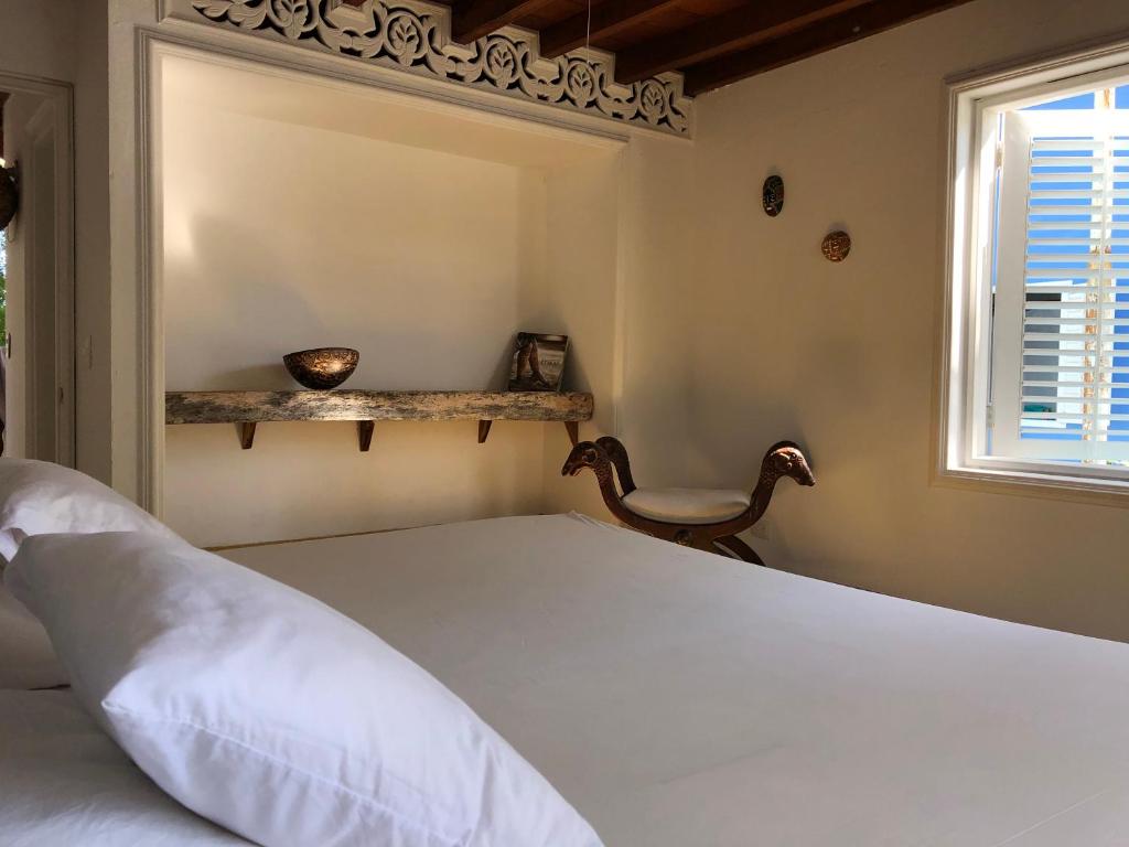 Postel nebo postele na pokoji v ubytování Hostal Secreto