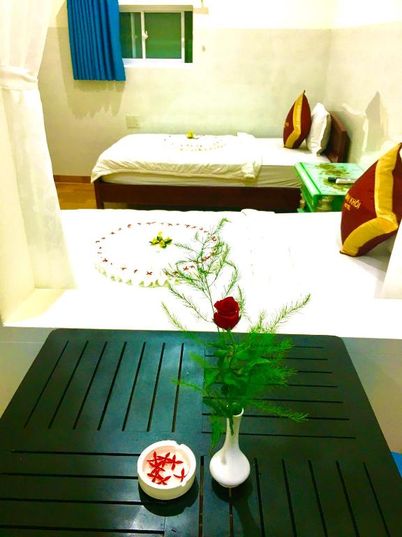 Giường trong phòng chung tại Minh Khoi Guest House
