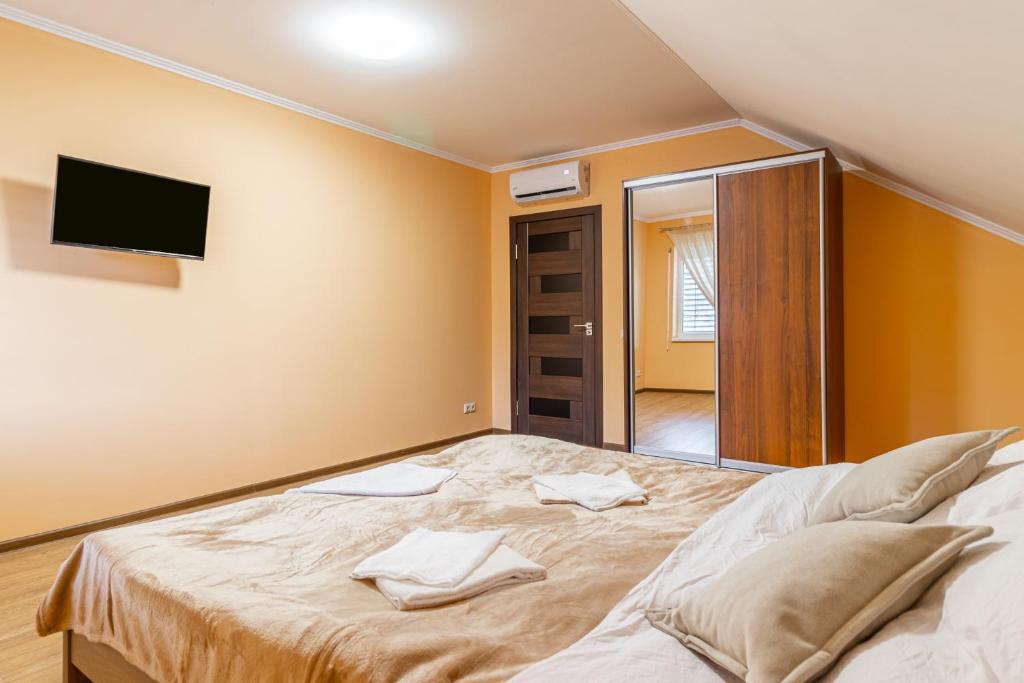 Postel nebo postele na pokoji v ubytování Nikol