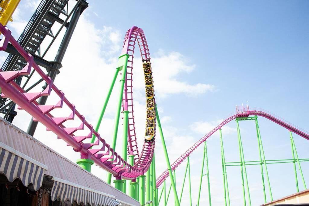 a pink roller coaster in a carnival park at Great Deals at The Grange, Ingoldmells in Skegness