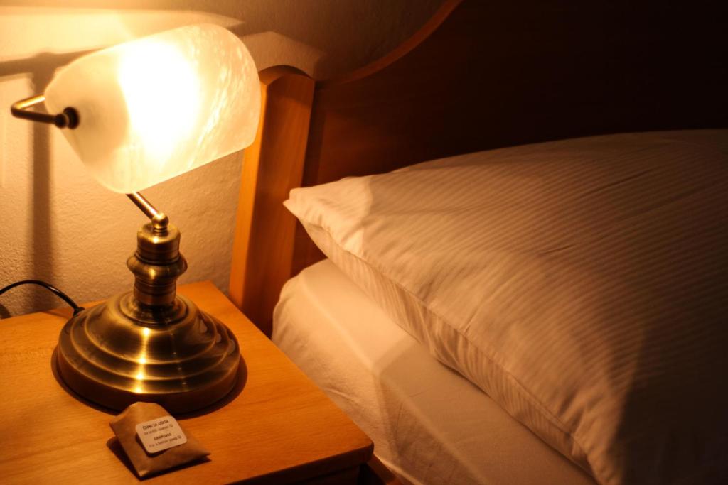 Postel nebo postele na pokoji v ubytování B&B Pod Skalo