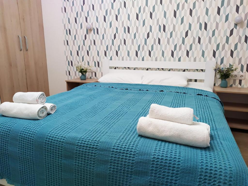Tempat tidur dalam kamar di Apartment Gagarinsky in Arcadia