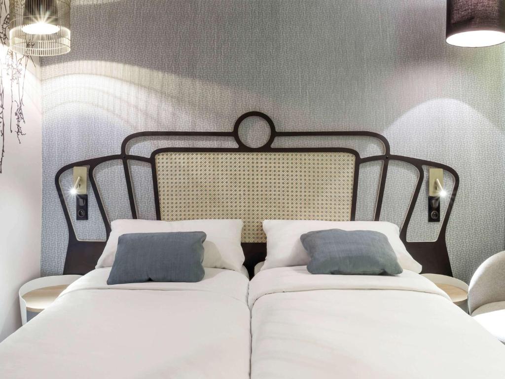Postel nebo postele na pokoji v ubytování Mercure Orléans Portes de Sologne