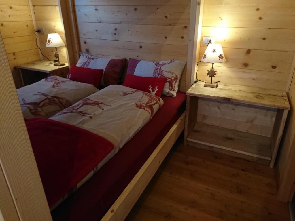 Posteľ alebo postele v izbe v ubytovaní Mini Chalet Walser