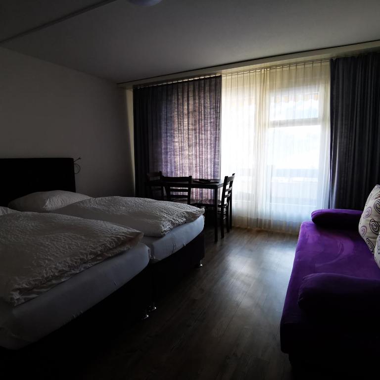 Postel nebo postele na pokoji v ubytování Hotel Crystal