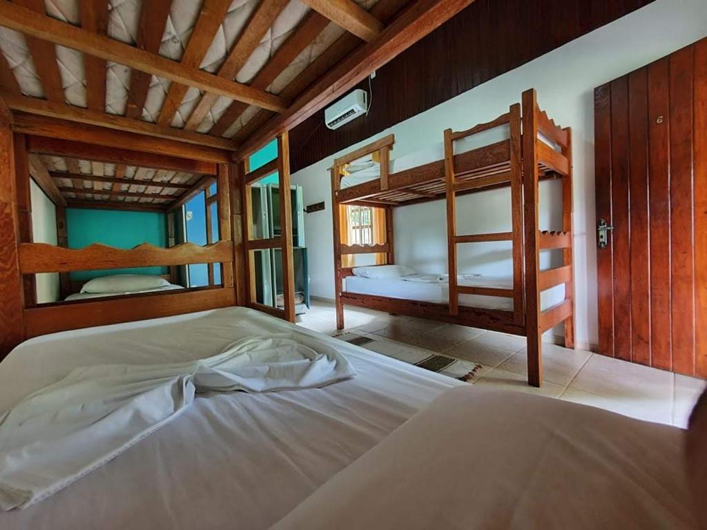 Postel nebo postele na pokoji v ubytování Pousada e Hostel Holandês