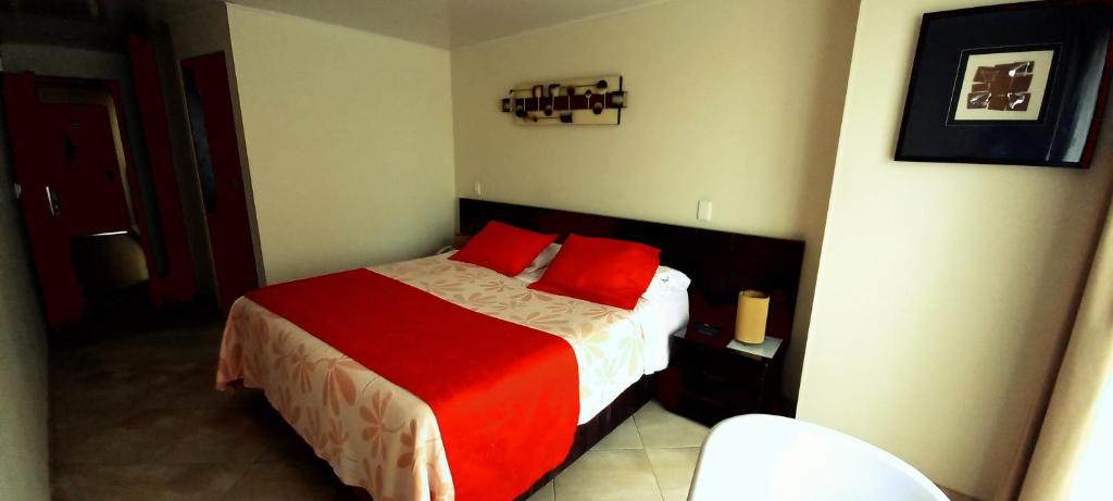 Postel nebo postele na pokoji v ubytování Hoteles Bogotá Inn Lago Chico Zona Rosa