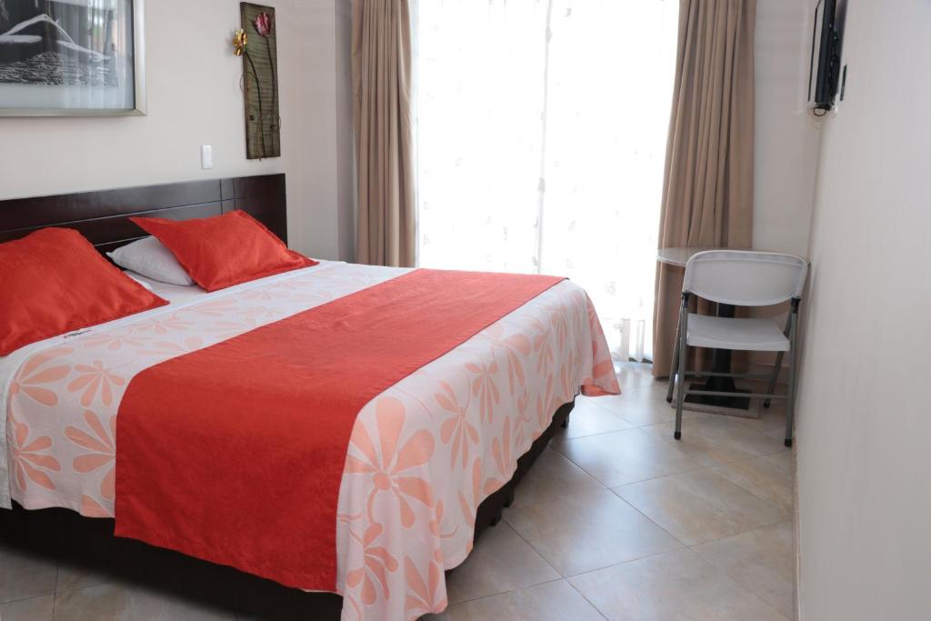 Postel nebo postele na pokoji v ubytování Hoteles Bogotá Inn Lago Chico Zona Rosa