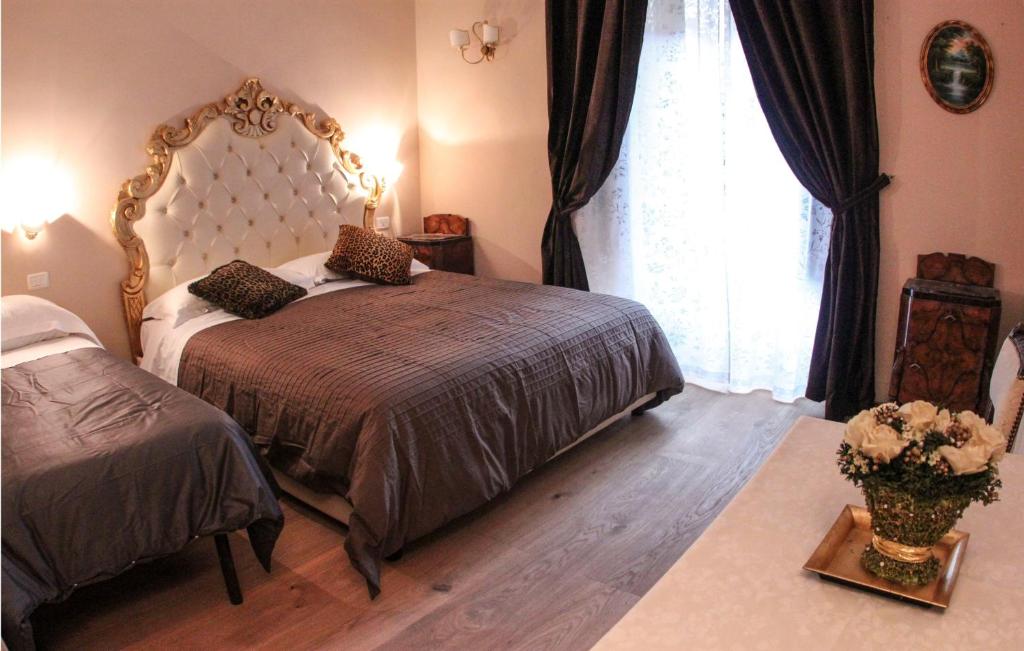 Postel nebo postele na pokoji v ubytování La Reggia dei Principi