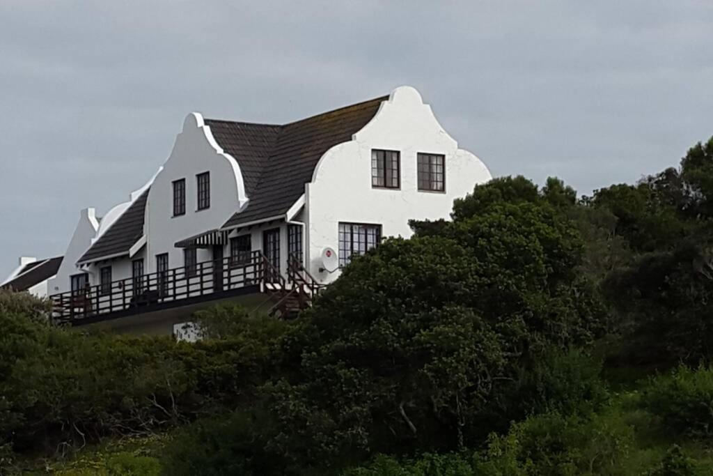 a large white house on top of a hill at WitsEnd Almost Heaven in St Francis Bay