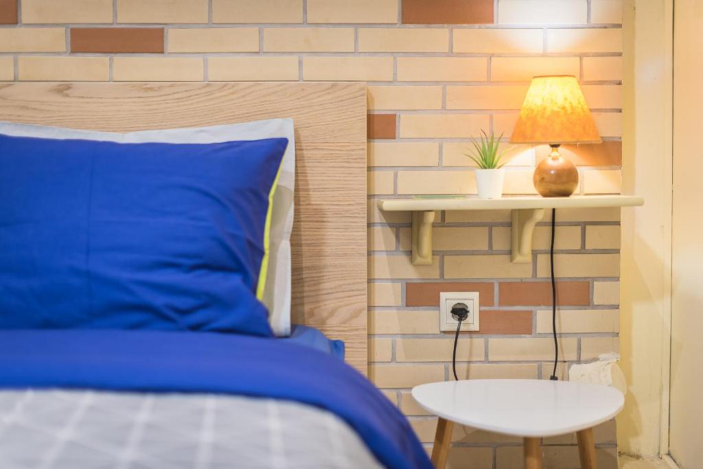 Postel nebo postele na pokoji v ubytování Amazing Apartment Pallini - Near Airport & Metro
