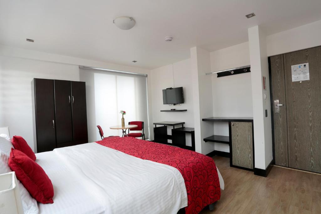 Postel nebo postele na pokoji v ubytování Hotel Bogota Expocomfort - Embajada Americana