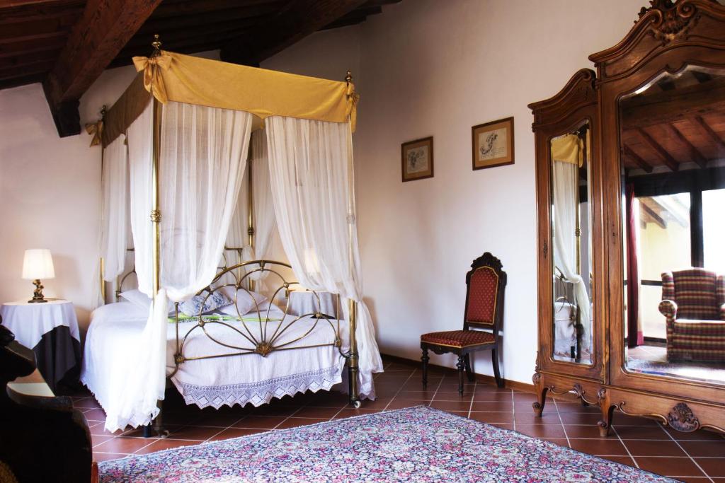 Postel nebo postele na pokoji v ubytování Villa Il Fedino