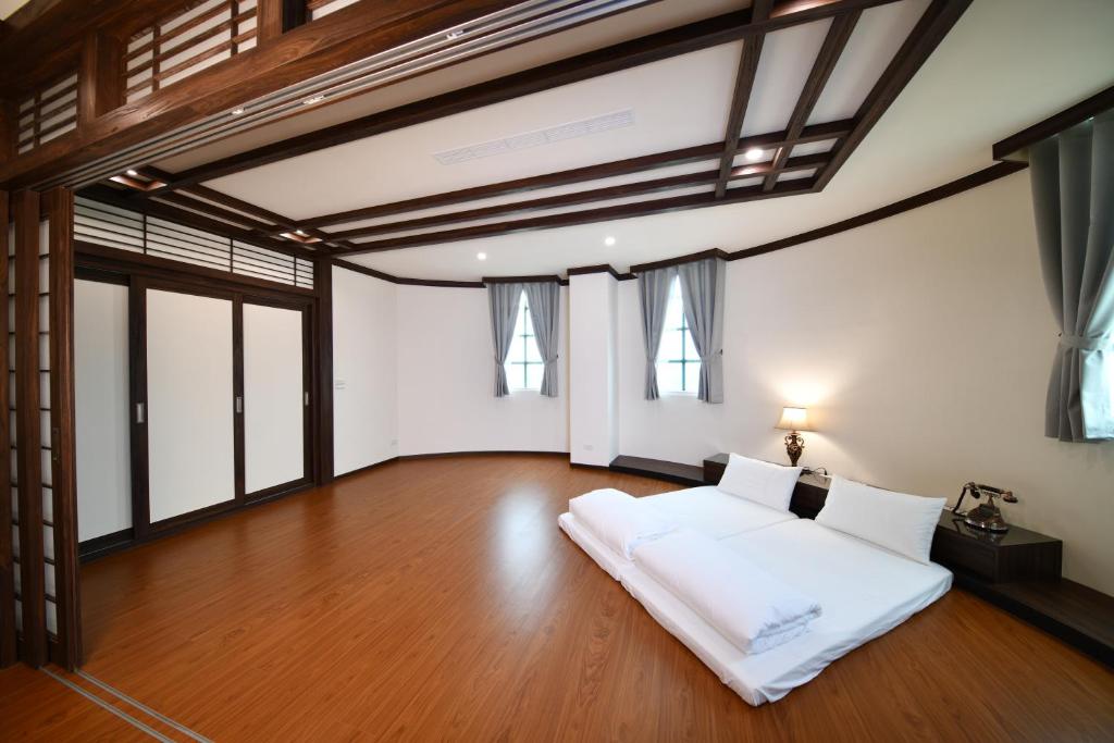 Postel nebo postele na pokoji v ubytování Chuan Cheng Castle