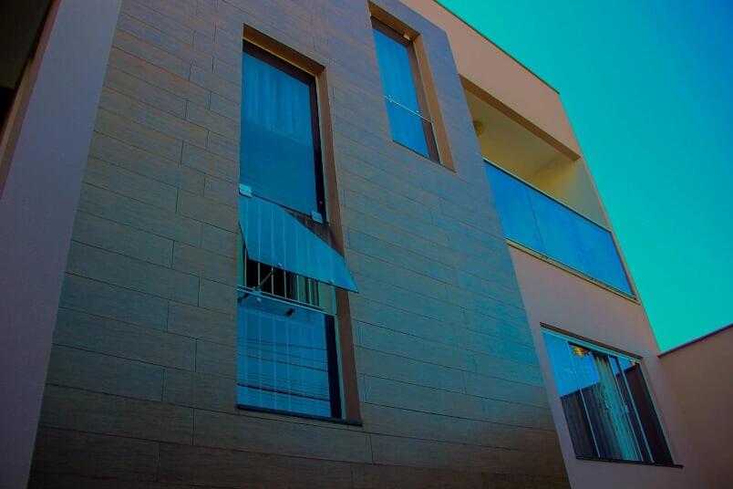 a building with windows on the side of it at Casa Rebello - Pousada in Itajaí