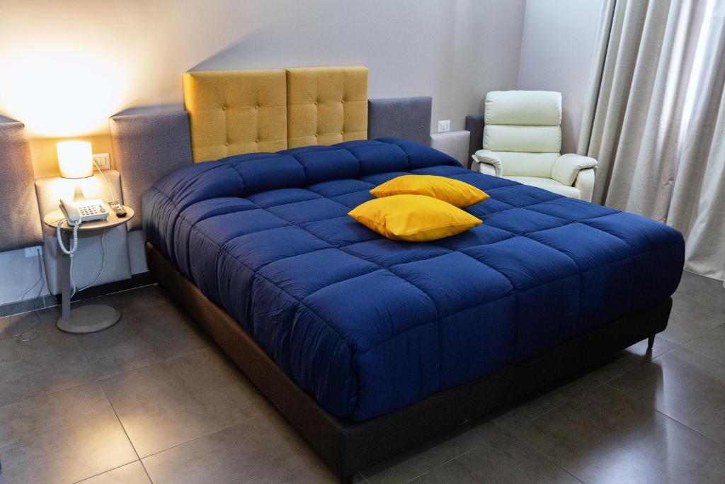 Postel nebo postele na pokoji v ubytování Hotel Eubea