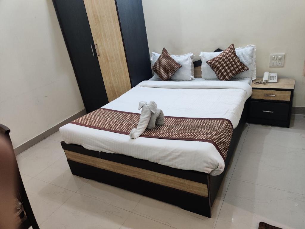 Postel nebo postele na pokoji v ubytování Hotel Holy Basil