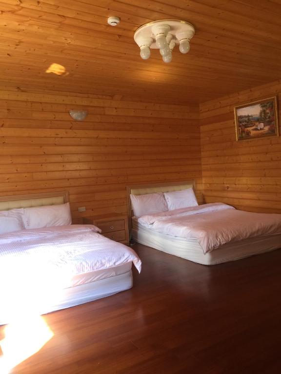 Postel nebo postele na pokoji v ubytování Yun Hsiang Zhan Chalet