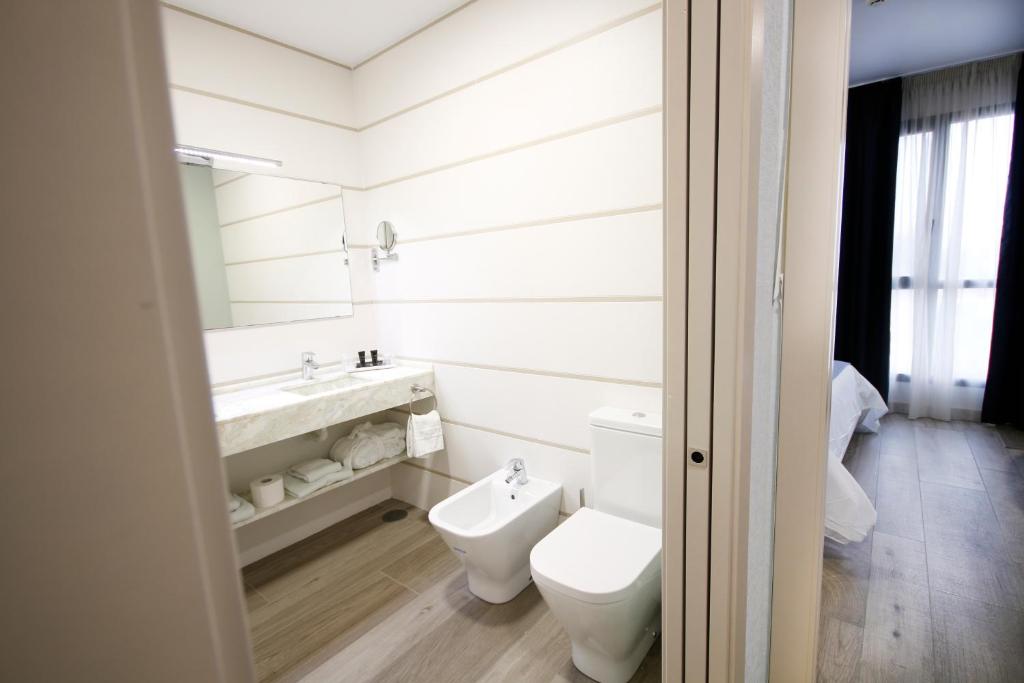 Koupelna v ubytování Hotel Leo