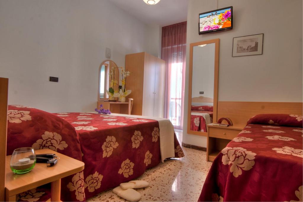 Postel nebo postele na pokoji v ubytování Hotel Hamilton